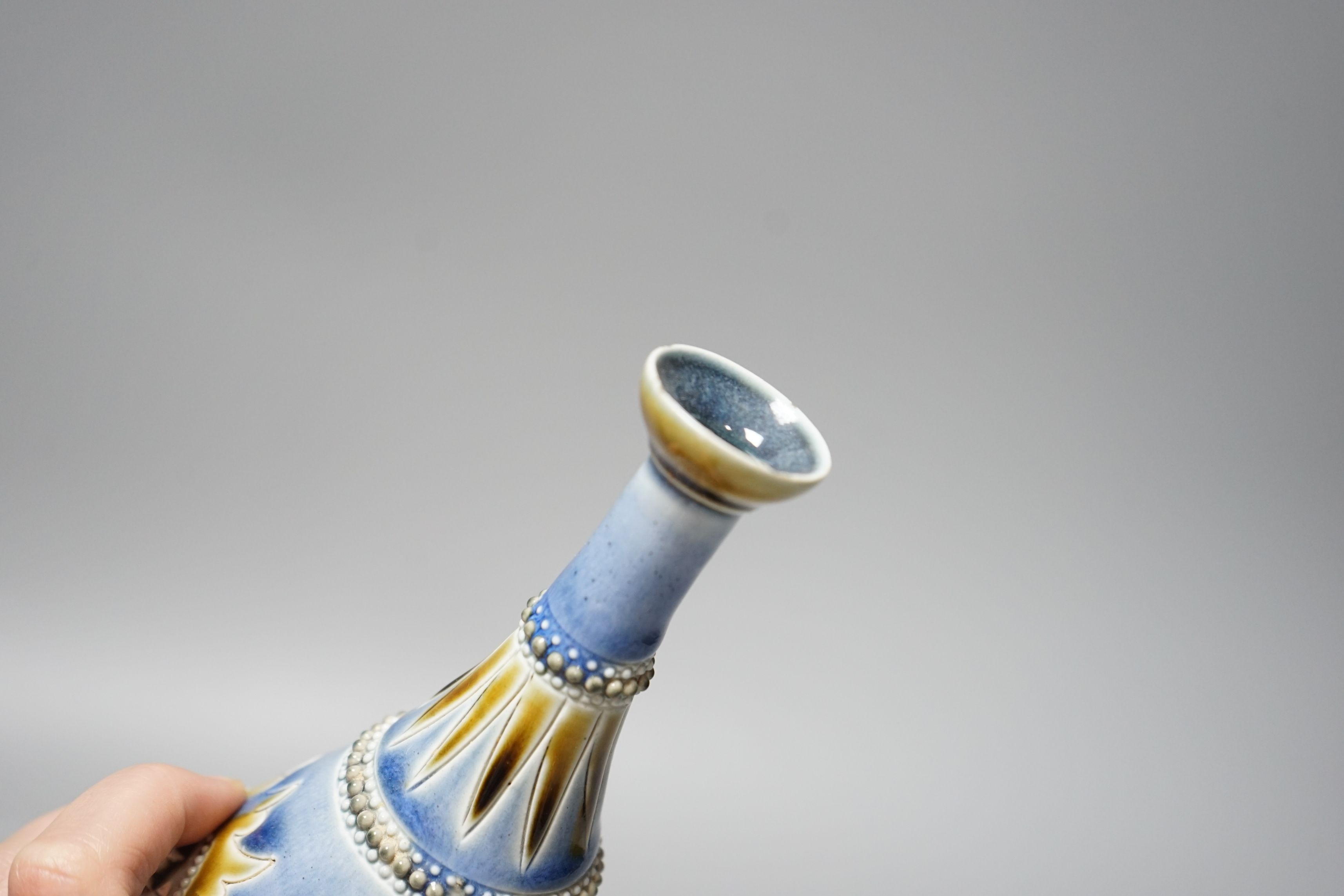George Tinworth, a pair of Doulton Lambeth vases, stamped 1876, 20cm high